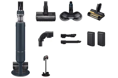 A collection of vacuum cleaner parts and accessories displayed against a white background.