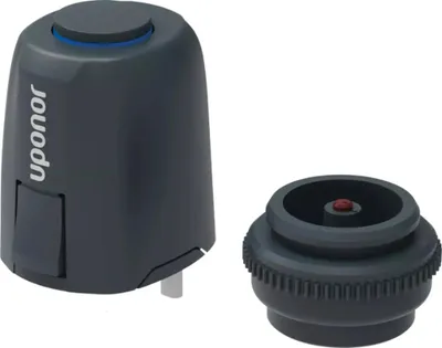 A product shot of a thermostat actuator and its base.
