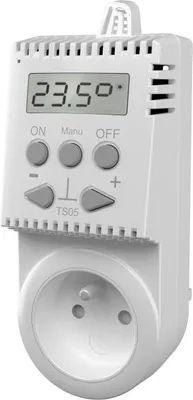 A white digital thermostat plugged into a wall socket.