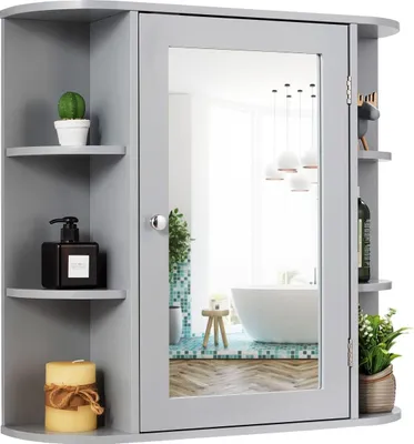 A gray wooden medicine cabinet with a mirror and shelves, displaying various bathroom accessories.