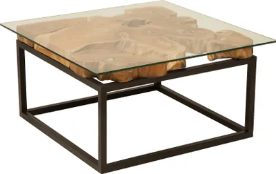 A square coffee table with a glass top and a base made of a metal frame and a teak root.