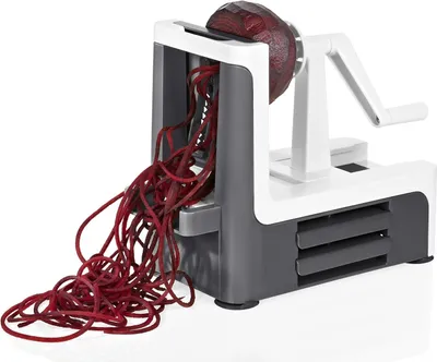 A spiralizer with a beet being spiralized.