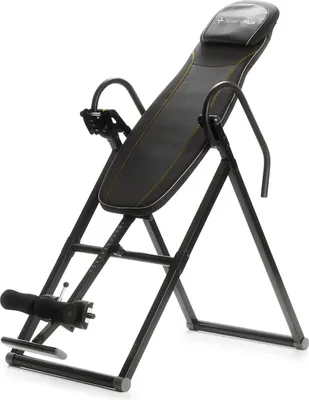 A black inversion table with a padded backrest and headrest, set against a white background.