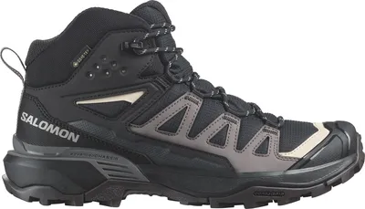 A side view of a black Salomon hiking boot.