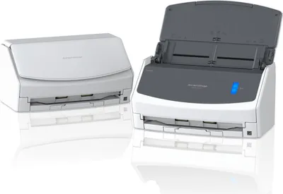 Two scanners are shown on a white reflective surface.