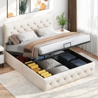 A bed with storage is shown with its storage compartment open, revealing folded linens and pillows.