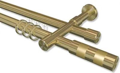 Close-up view of two brass curtain rods with rings and decorative ends.