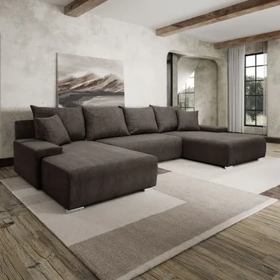 A spacious living room with a large sectional sofa, a painting on the wall, and wooden beams on the ceiling.