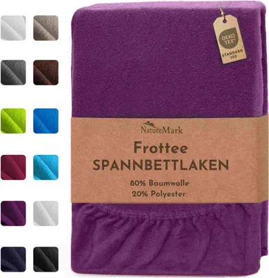A purple fitted sheet is shown, with a band of text and a small tag attached to it.