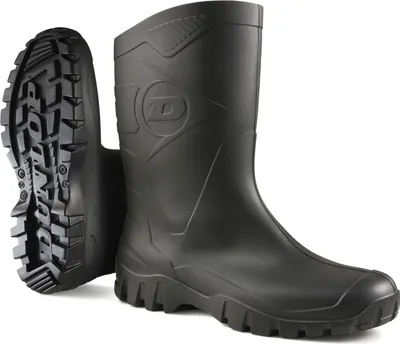 A pair of black Dunlop boots shown from the side and sole view against a white background.