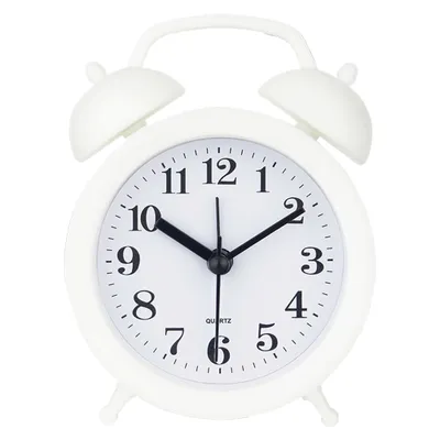 A white analog alarm clock with a twin bell top.