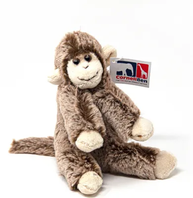 A plush toy monkey sitting against a white background.