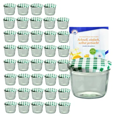 A set of small glass jars with green and white checkered lids, along with a recipe booklet.