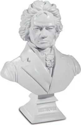 A white bust of Ludwig van Beethoven on a white pedestal.