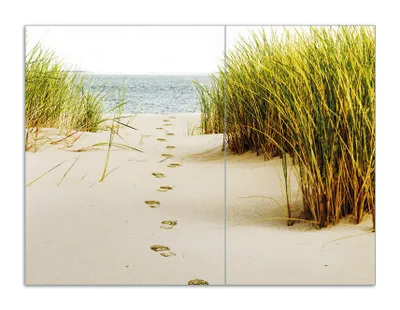 Produktbild von Wallario Herdabdeckplatte aus Glas, Größe 70 x 52 cm 2-teilig, Motiv Spuren im Sand- Fußspuren durch die Düne zum Meer