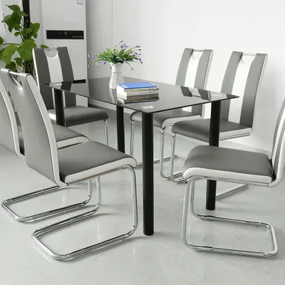 A dining table with chairs in a room.