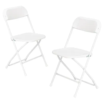 Two white folding chairs are shown against a white background.