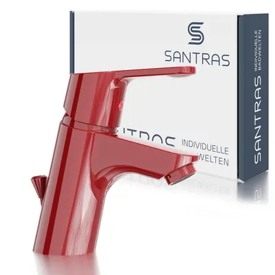 A red faucet is displayed in front of its packaging.
