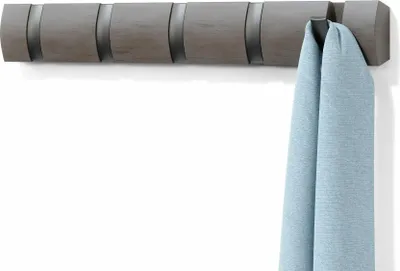 A gray coat rack with multiple hooks is mounted on a white wall. A light blue scarf is hanging from one of the hooks.