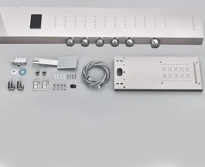 A shower panel system and its accessories laid out on a light gray surface.