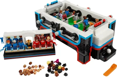A LEGO Ideas 21337 Table Football set is displayed with its components and accessories.