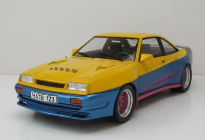 Produktbild von MCG MCG18095 - 1:18 Opel Manta B Mattig, gelb/blau, 1991 - Neu