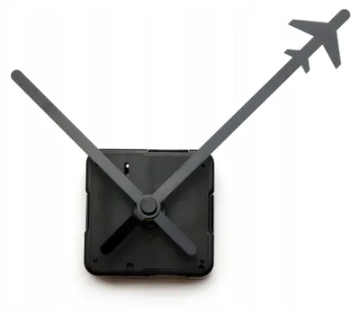 A close-up shot of a clock mechanism with airplane-shaped hands against a white background.