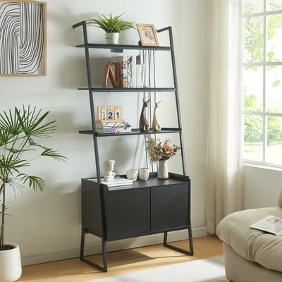 A black ladder shelf with a cabinet is filled with decorative items and books, placed in a well-lit room next to a window.