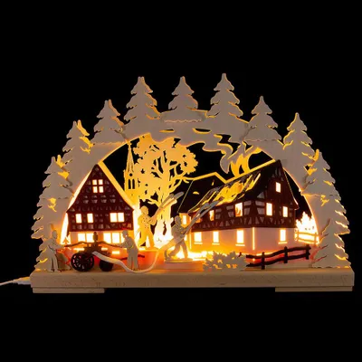 A wooden illuminated Christmas decoration depicting firefighters battling a house fire.