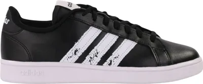 A side view of a black Adidas sneaker with white stripes.