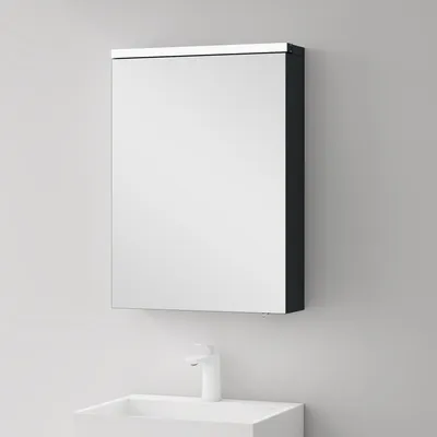 A bathroom cabinet with a mirror above a sink and faucet.