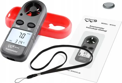 An anemometer and its accessories are laid out on a white background, with an instruction manual visible.