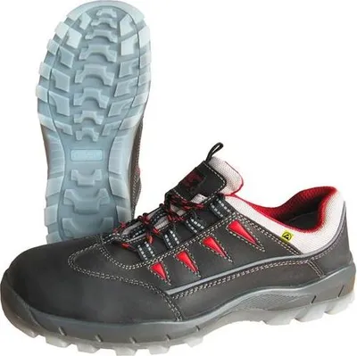 A pair of black safety shoes with red accents and a white sole is shown against a white background. One shoe is shown from the side, and the sole of the other shoe is shown from underneath.