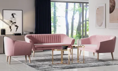 A living room scene with pink velvet furniture and a large window overlooking a forest.