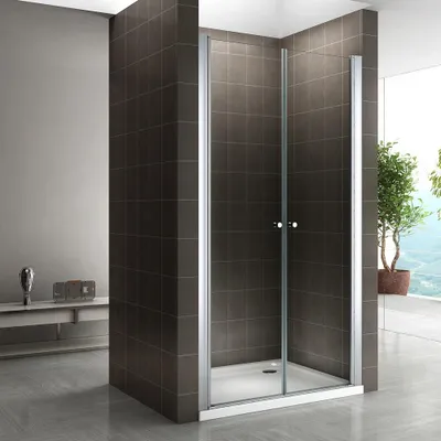 A modern bathroom with a glass shower enclosure.