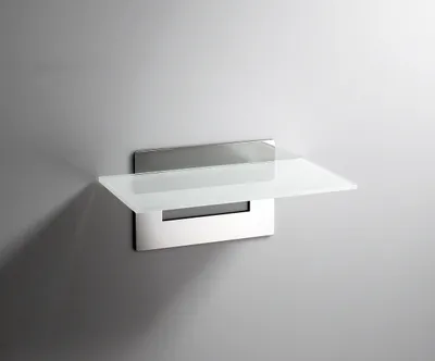 A modern glass shelf mounted on a gray wall.