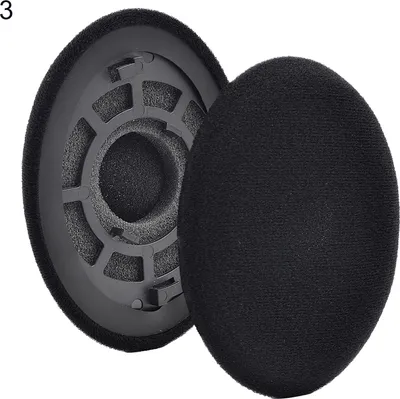 A pair of black ear pads for headphones, with one pad detached and showing the inner foam and plastic frame.