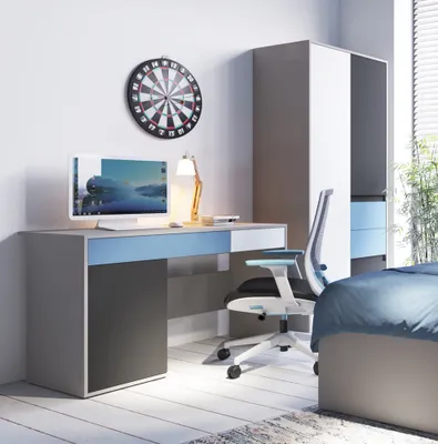 A modern bedroom setup with a desk, chair, and wardrobe.