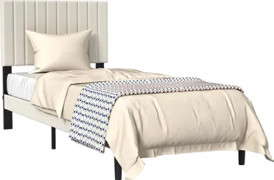 A single bed with a beige upholstered headboard and frame, dressed with beige bedding and a patterned throw blanket.