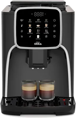A black automatic coffee machine with a digital display and two cups of coffee.