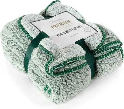 A folded blanket with a label attached.