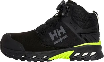 A black work boot with neon yellow accents is shown against a white background.