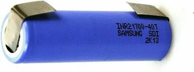 A single blue lithium-ion battery with silver metal contacts at one end and text printed on its side.