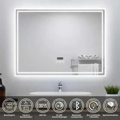 A modern LED bathroom mirror with integrated features displayed above a sink.