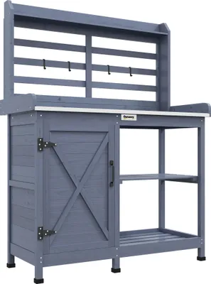 Produktbild von Outsunny Pflanztisch aus Holz, Gärtnertisch mit Schrank, Blumentisch mit Arbeitsplatte, Holzpflanztisch mit 2 Ablagen, 4 Haken für Garten, Grau, 112 x 47 x 146cm