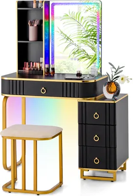 A black and gold vanity set with a lighted mirror and stool, displayed against a white background.