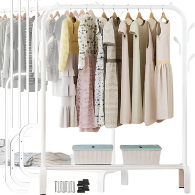 A white metal garment rack with various dresses and clothes hanging on it, and two storage bins on the bottom shelf.