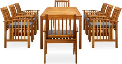 A wooden dining set with cushions arranged around a table.
