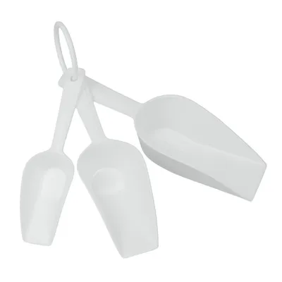 Three white plastic scoops of different sizes are arranged in a cluster on a white background.