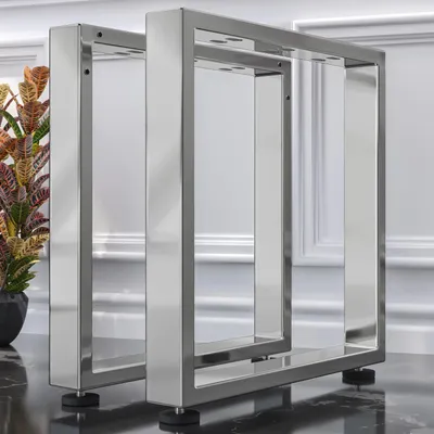 Two metal table legs are shown in a studio setting against a white and gray background.
